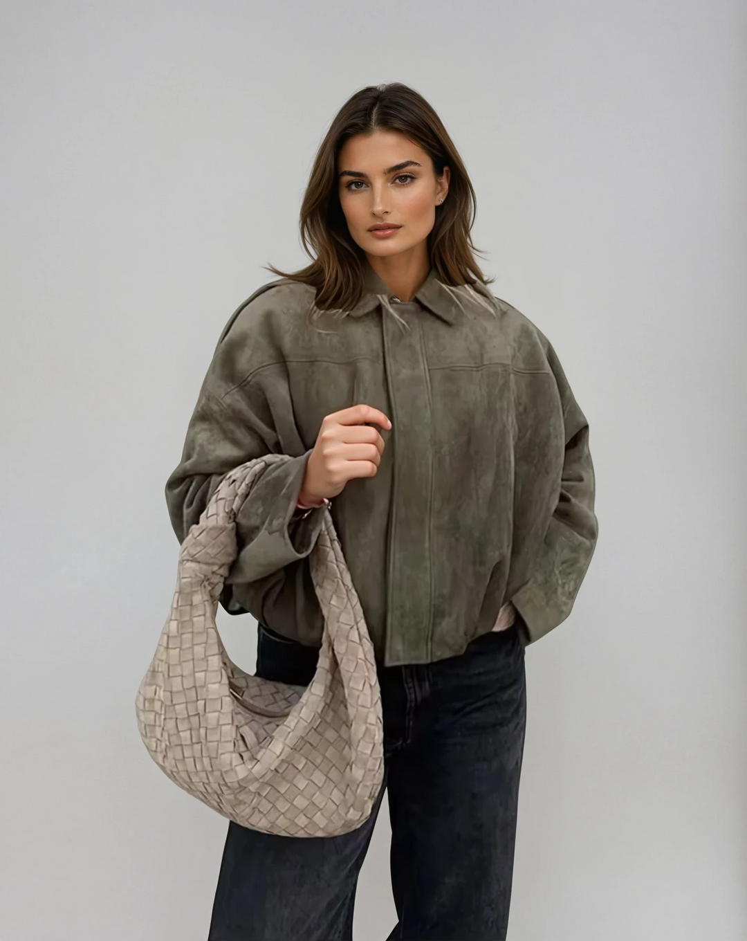 Women's vintage oversized bomber jacket in a classic dark color, perfect for casual layering outerwear.