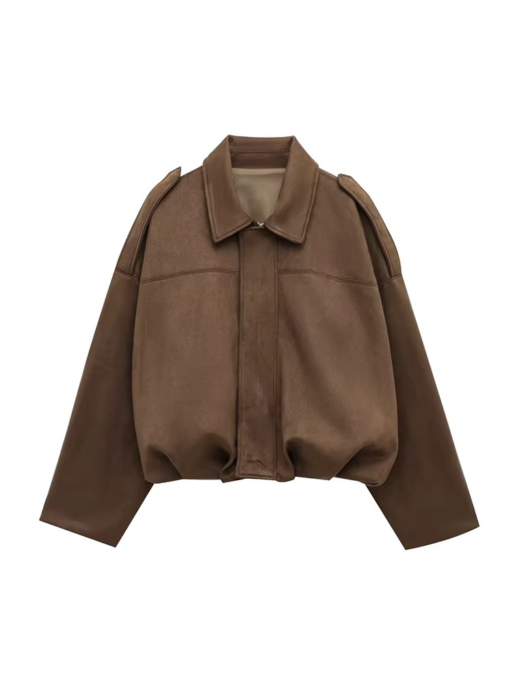 Woman wears stylish oversized vintage bomber jacket, perfect for chic casual outerwear & layering.