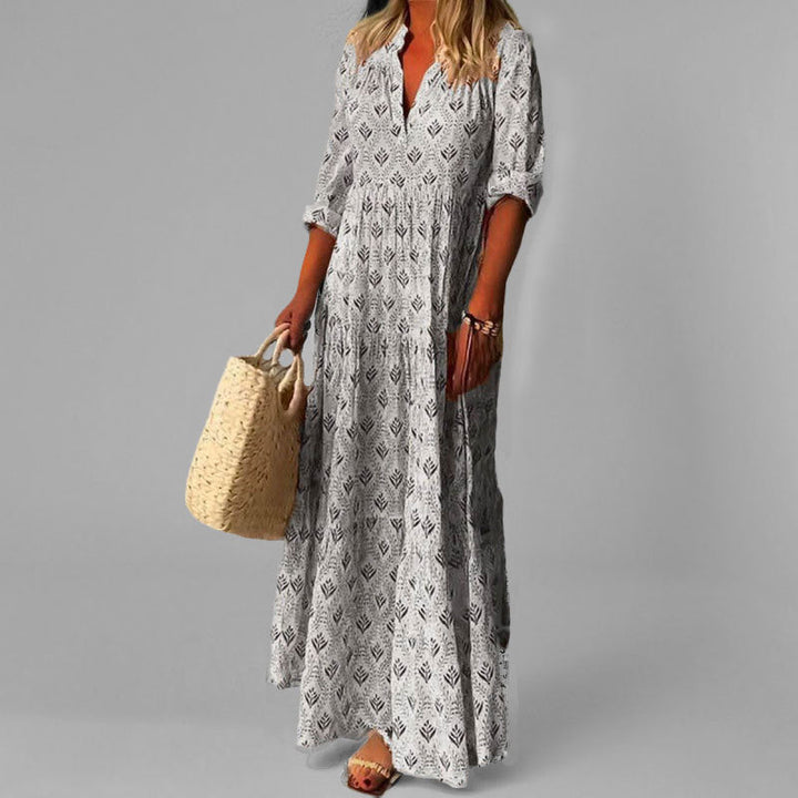 Boho-style women's V-neck maxi dress in soft cotton, featuring an elegant vintage print for a unique look.