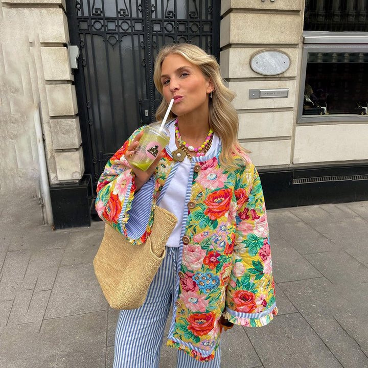 Stylish women's vintage quilted jacket with intricate floral patchwork. A unique statement piece for fall fashion.