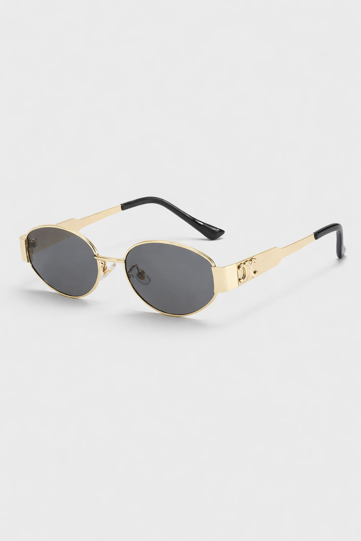 Elegant women's vintage round metal sunglasses. Fashionable retro eyewear with UV400 lenses, a chic accessory.
