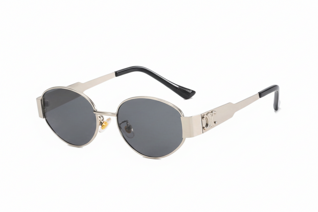 Vintage round metal sunglasses for women, featuring a retro design and UV400 protection. Stylish fashion eyewear.