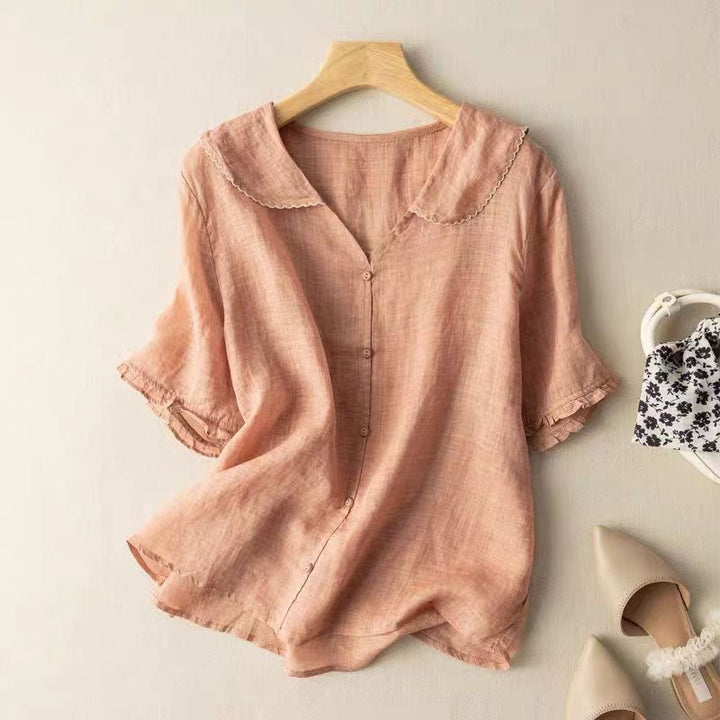 Elegant women's button-up blouse with chic button detailing, long sleeves, and timeless design for classic fashion.