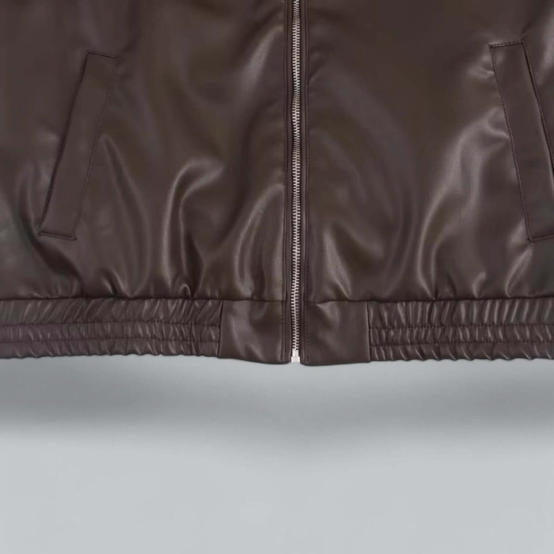 Fashionable women's faux leather jacket, vintage inspired. A chic and durable outerwear piece.
