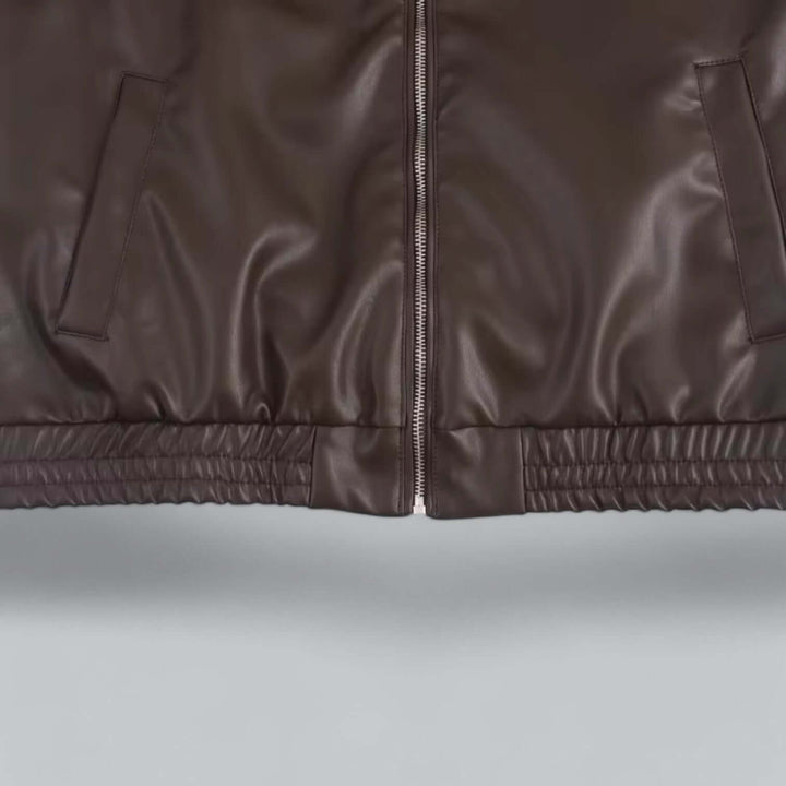 Fashionable women's faux leather jacket, vintage inspired. A chic and durable outerwear piece.