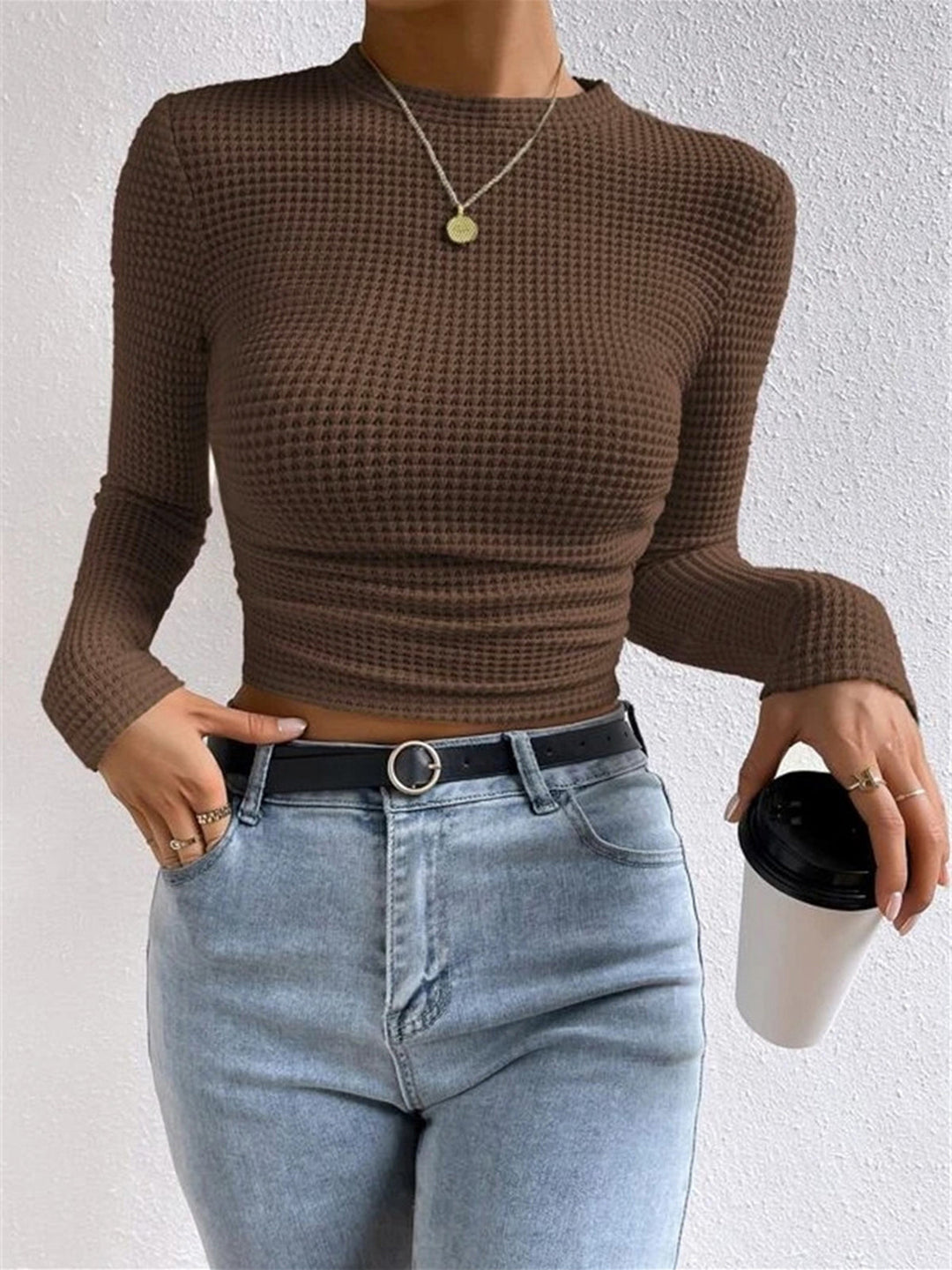 Women's slim fit waffle knit long sleeve top, crew neck. Soft, textured, and ideal for layering.