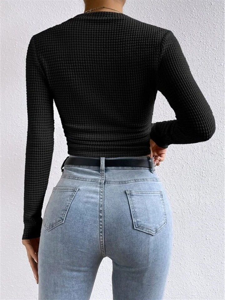 Flattering slim fit women's long sleeve top, crew neck. Cozy waffle knit for a stylish everyday look.