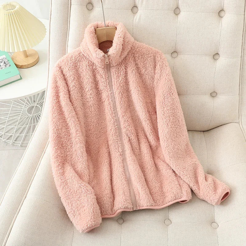 Comfortable women's fleece jacket for winter, offering cozy warmth and casual outerwear style.
