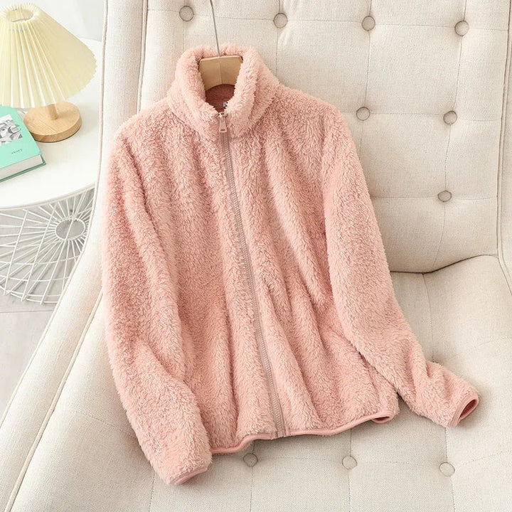 Comfortable women's fleece jacket for winter, offering cozy warmth and casual outerwear style.