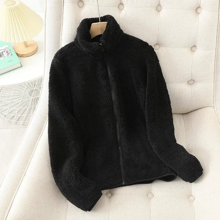 Women's warm fleece jacket, designed for cozy comfort and stylish layering in cold weather.