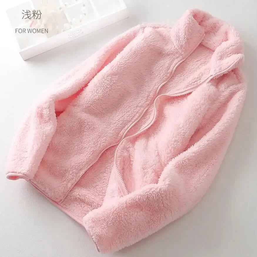 Warm women's zip fleece jacket, perfect for layering and staying cozy in chilly winter months.