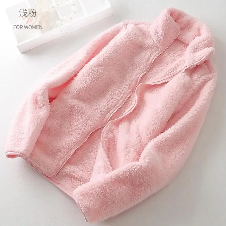 Warm women's zip fleece jacket, perfect for layering and staying cozy in chilly winter months.