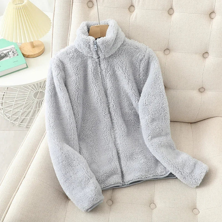 Soft women's cozy fleece jacket, perfect for winter adventures & casual layering.