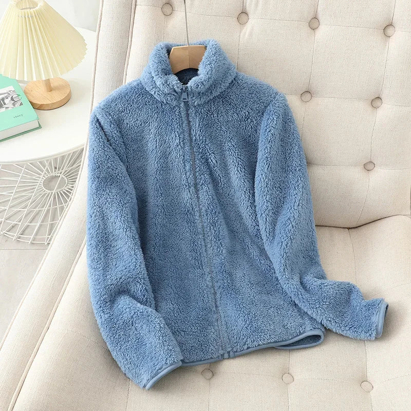 Zip-up women's fleece jacket, perfect for warmth and layering during chilly winter days.