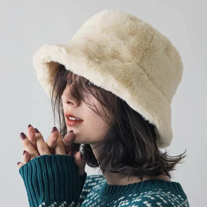 Fashionable women's faux fur bucket hat, a chic autumn & winter headwear choice.