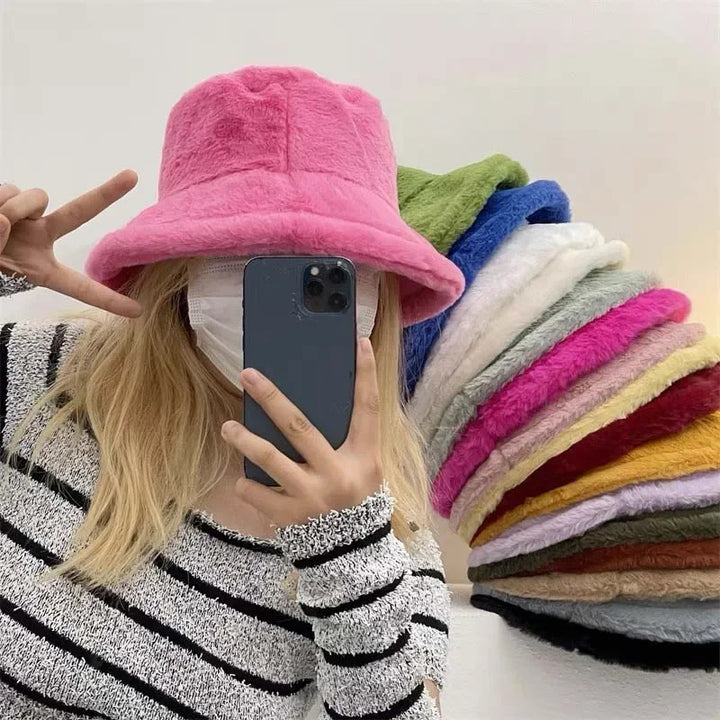 Warm women's faux rabbit fur bucket hat, a cozy autumn-winter fashion staple.