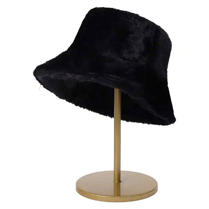 Stylish women's faux fur bucket hat, a warm winter accessory for ladies.