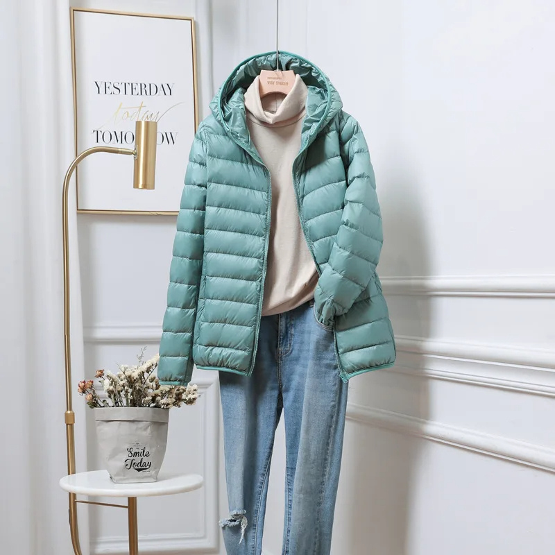 Cozy women's hooded puffer jacket, offering ultimate warmth for severe cold weather.