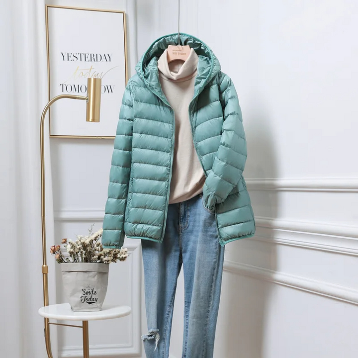 Cozy women's hooded puffer jacket, offering ultimate warmth for severe cold weather.
