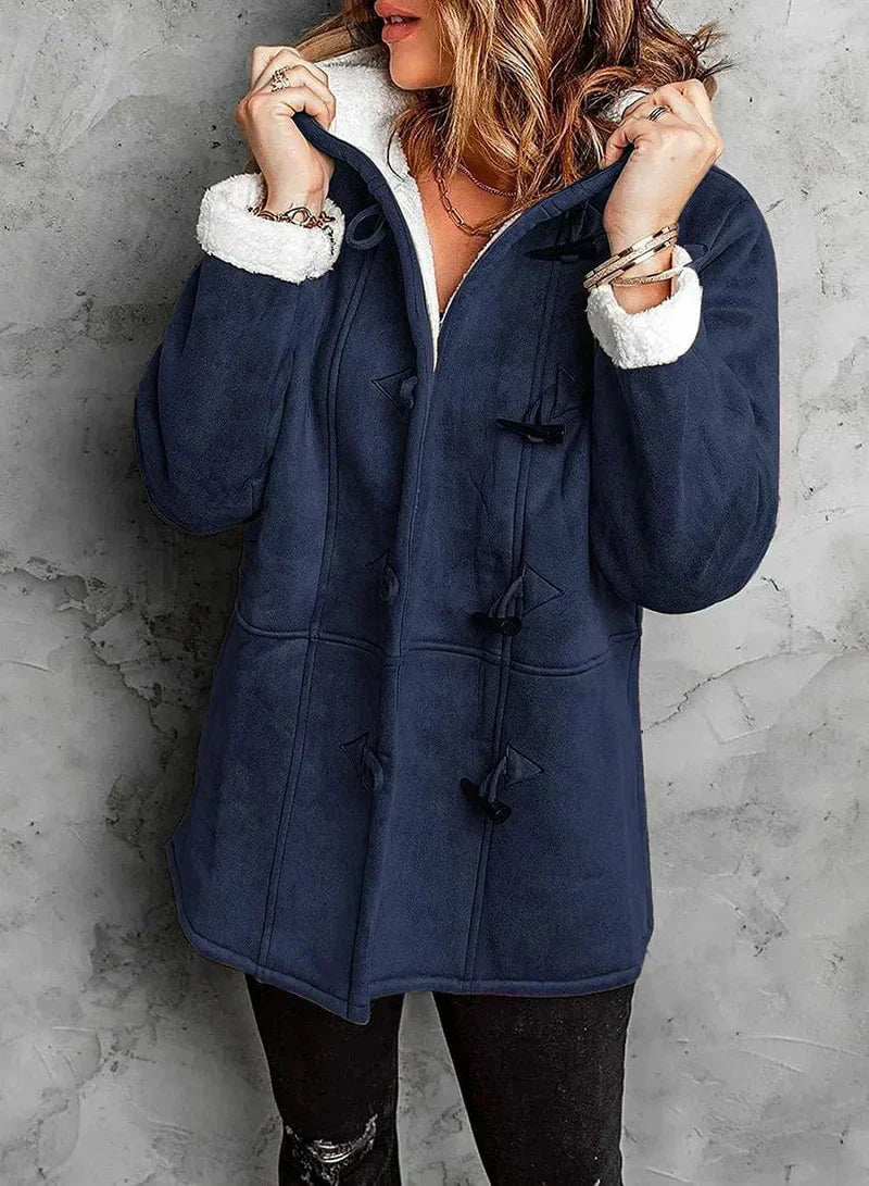 Durable women's warm hooded winter coat, built to withstand cold weather while staying fashionable.