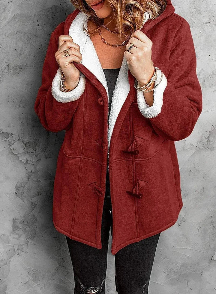 Plush women's warm hooded winter coat for ultimate coziness, a perfect outerwear piece for snowy days.