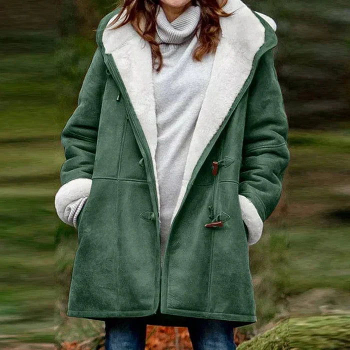 Close-up of toggle details on a women's warm hooded winter coat, highlighting its unique style.