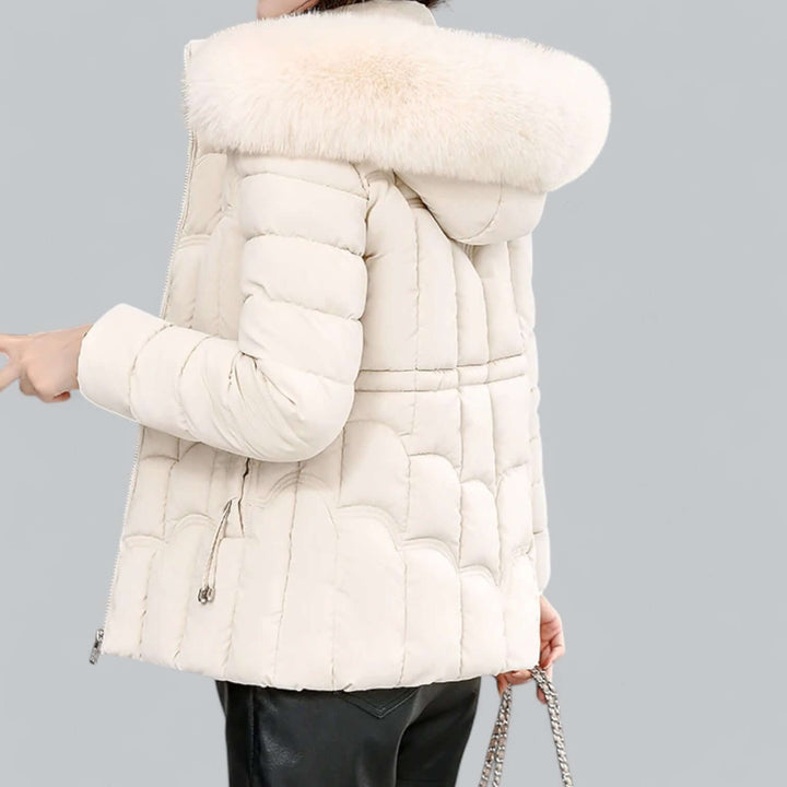 Thickly padded women's winter parka jacket, water-resistant, with a soft faux fur hood.