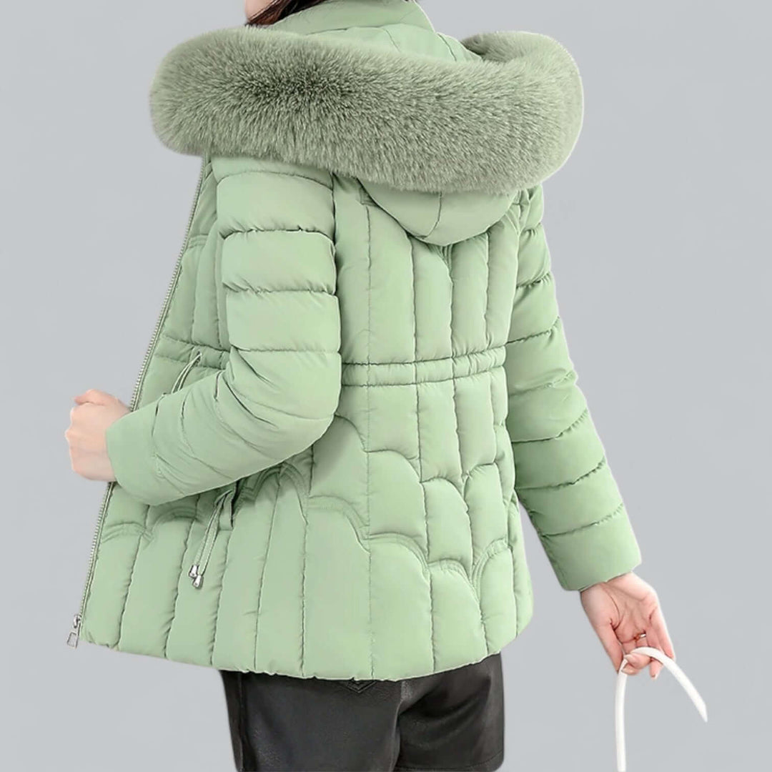Durable women's outerwear parka, padded and warm, with a protective faux fur hood for winter.