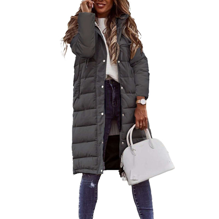 Elegant women's warm padded winter coat with a cozy hood, a stylish quilted long jacket for cold weather.