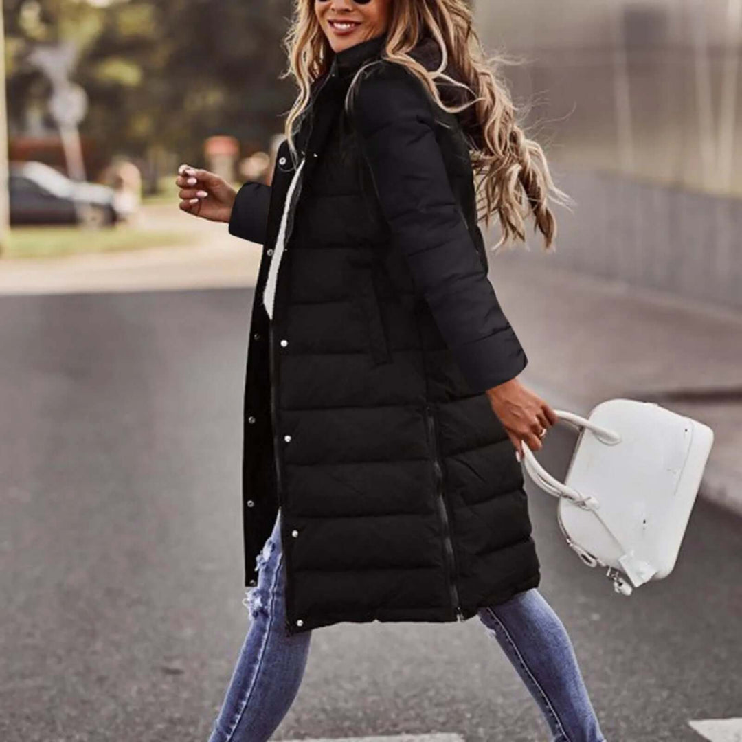 Long women's padded winter coat with a warm hood, stylish and practical for winter outerwear.