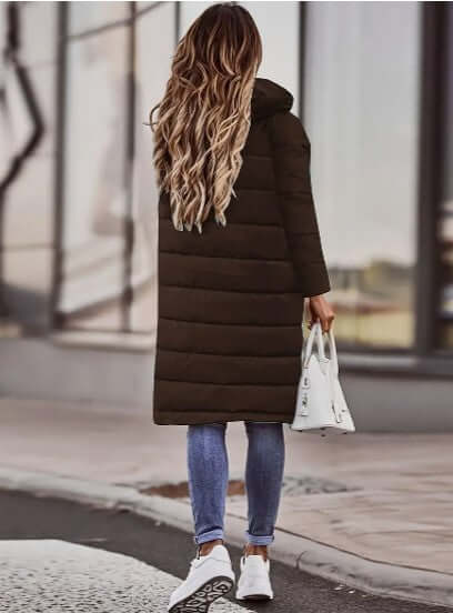 Quilted women's warm padded winter jacket with a hood, perfect for stylish cold-weather fashion.
