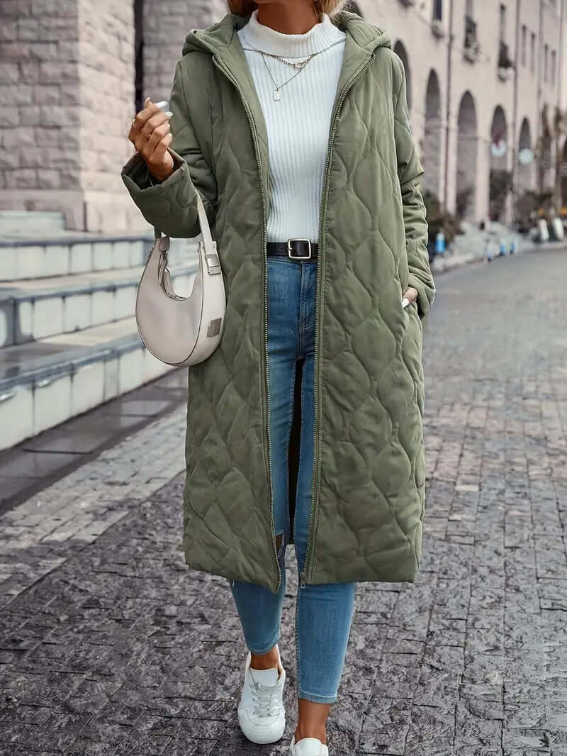 Women's warm quilted down coat with hood, perfect for winter. Stylish puffer jacket outerwear for cold weather.