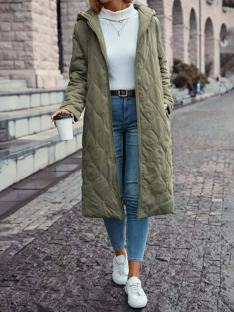 Cozy women's insulated down puffer coat with hood. Ideal warm winter jacket for cold weather fashion.