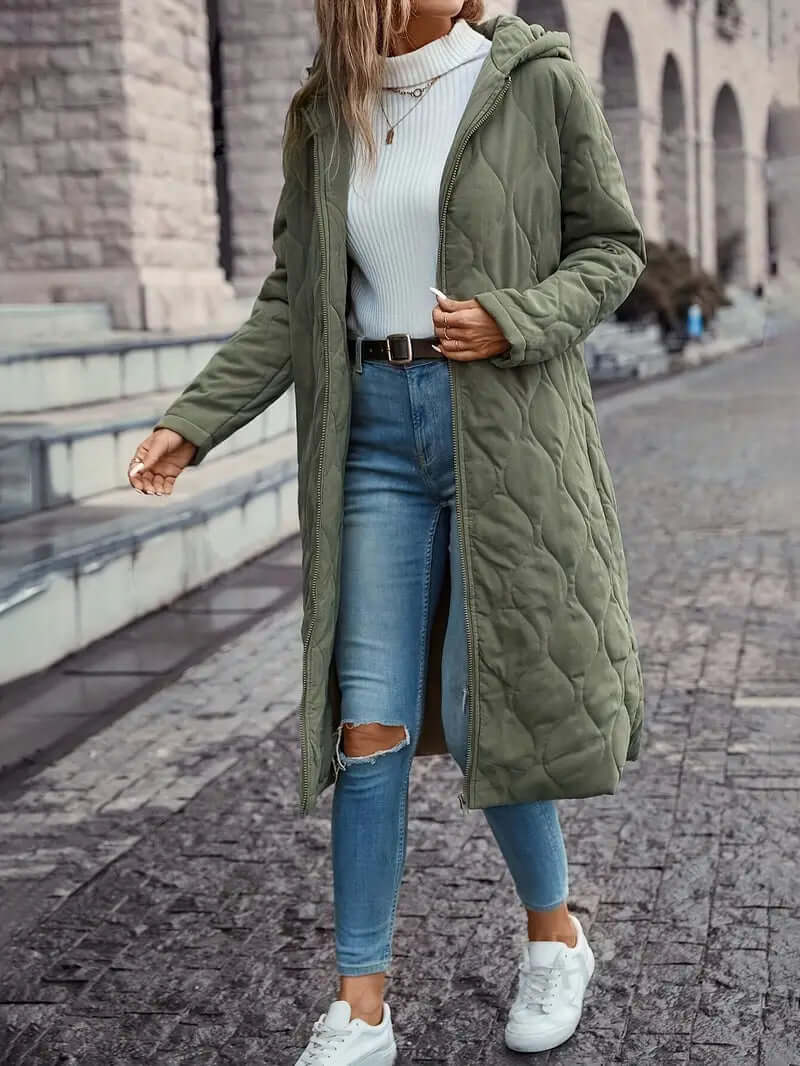 Warm women's down-filled quilted coat with hood. Essential winter puffer jacket, cozy insulated outerwear.
