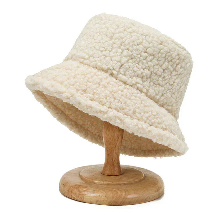 Women's warm teddy bucket hat, cozy winter fashion accessory for cold weather style.