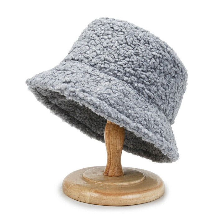 Chic women's teddy bucket hat, a plush and warm fashion accessory for cold weather.
