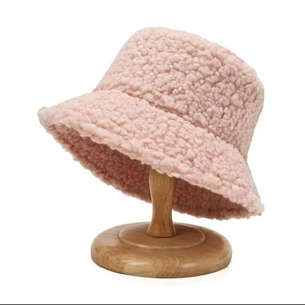 Cozy women's teddy bucket hat, ideal winter fashion headwear for warmth and style.