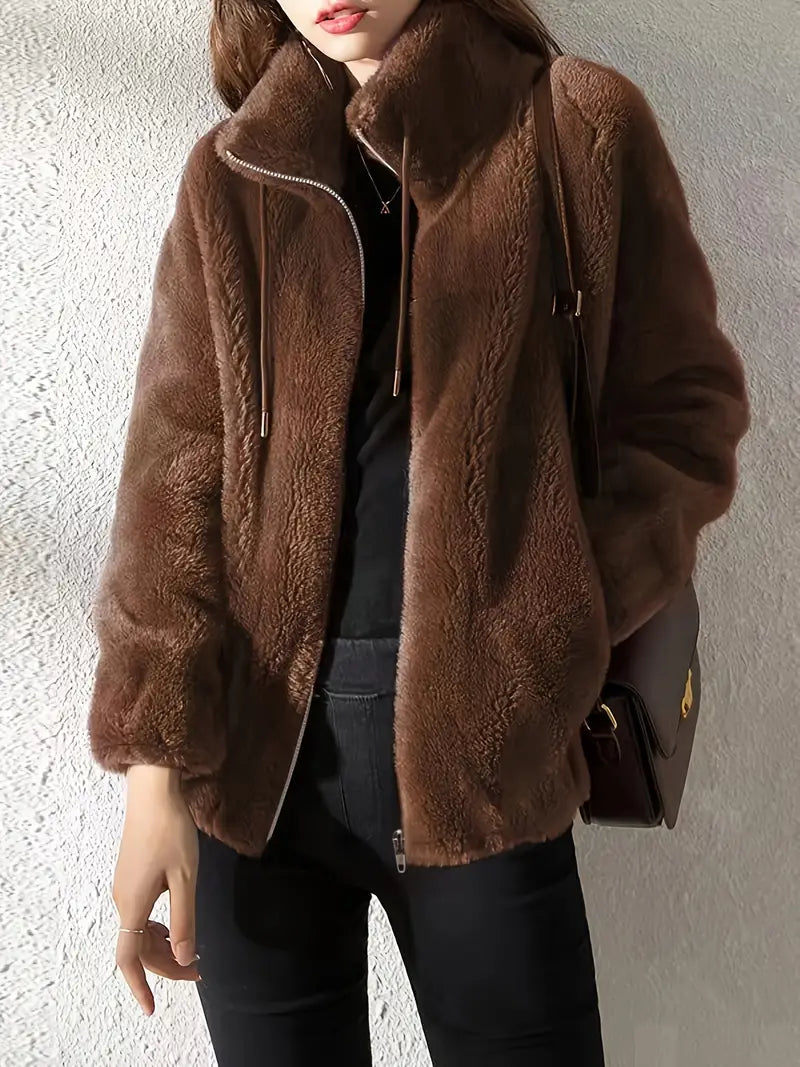 Stylish women's teddy coat, Isla, featuring a convenient zipper closure and adjustable drawstring for casual fall wear.