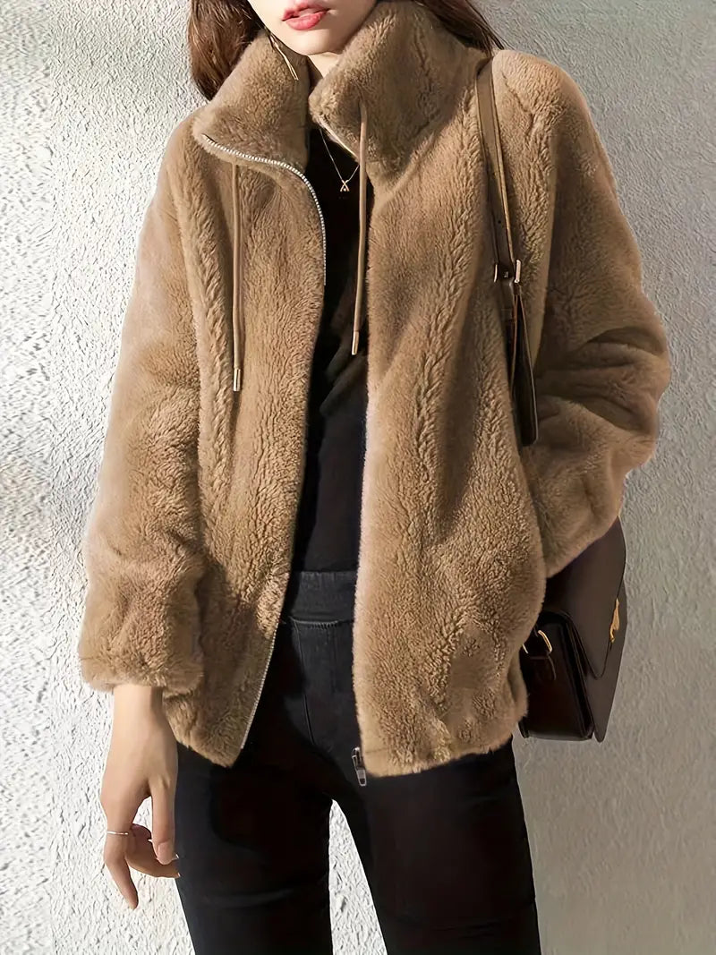 Soft women's teddy fleece coat, Isla, with warm lining, practical zipper, and drawstring for cozy outerwear.