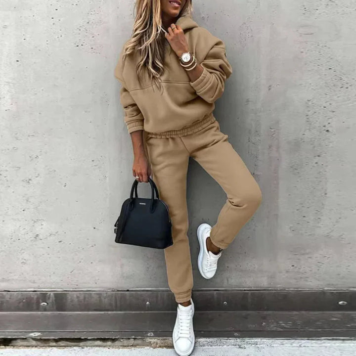 Cozy women's two-piece winter tracksuit, perfect for warmth & comfort. Includes a soft zip jacket and warm joggers.