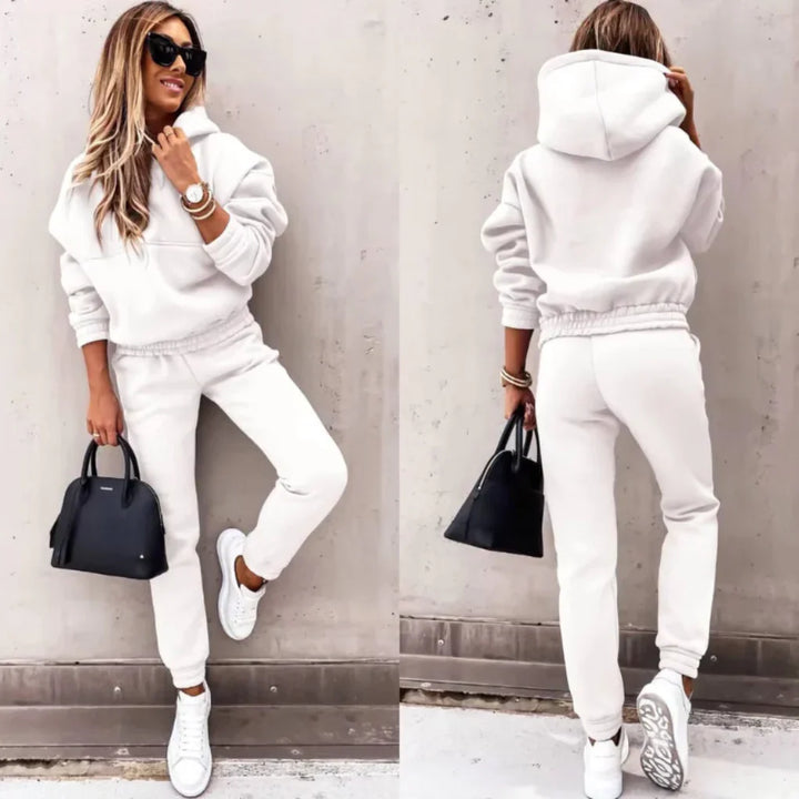 Women's two-piece winter tracksuit with a warm zip-up jacket and comfortable cuffed joggers, ideal for casual wear.