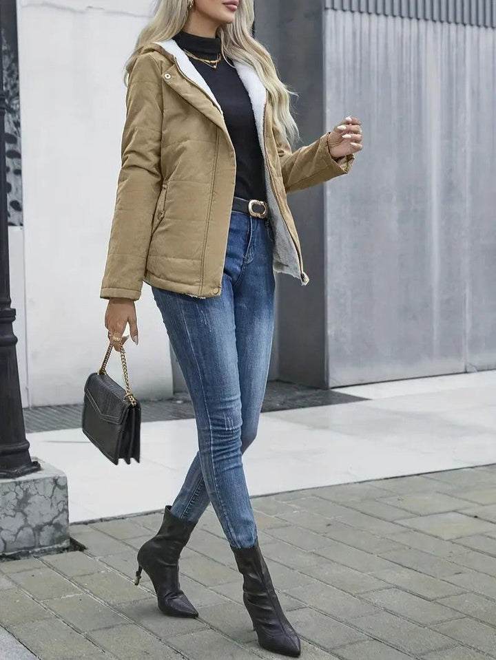 Women's comfortable zip-up hooded winter coat, great for outdoor activities.