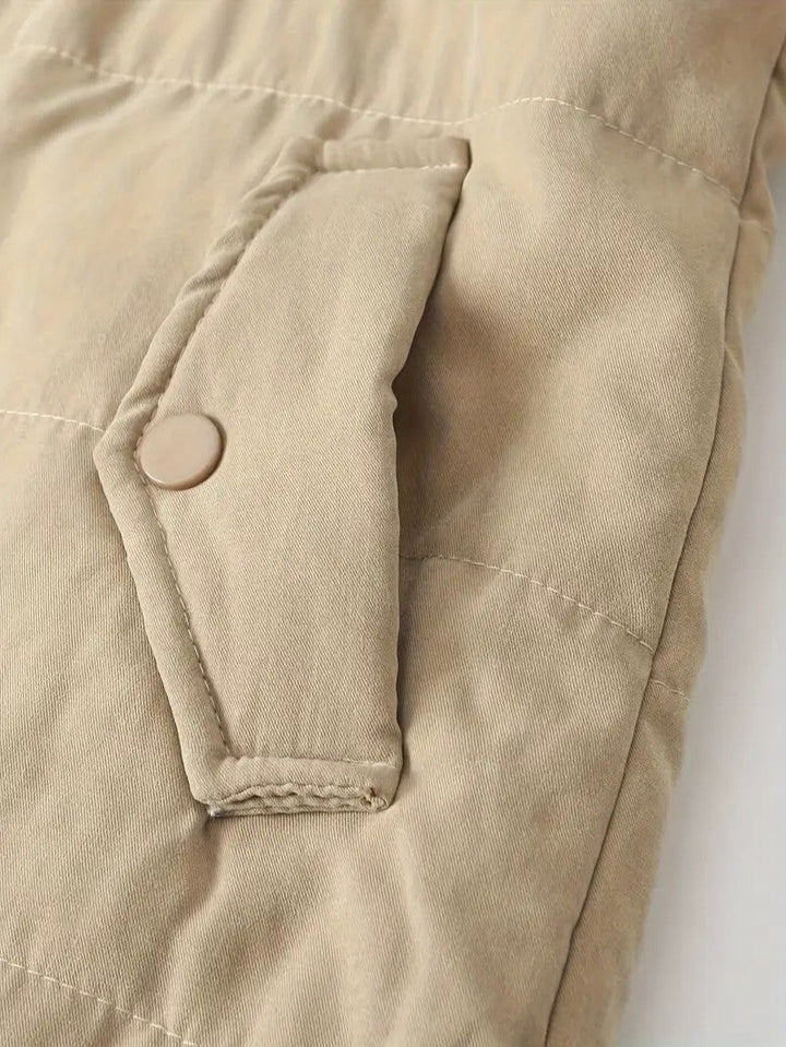 Warm women's zip-front hooded jacket for winter, offering style & protection.