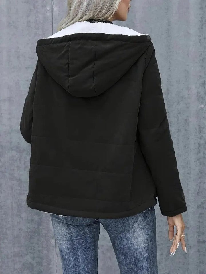 Women's casual hooded zip-up winter jacket, perfect outerwear for seasonal cold.