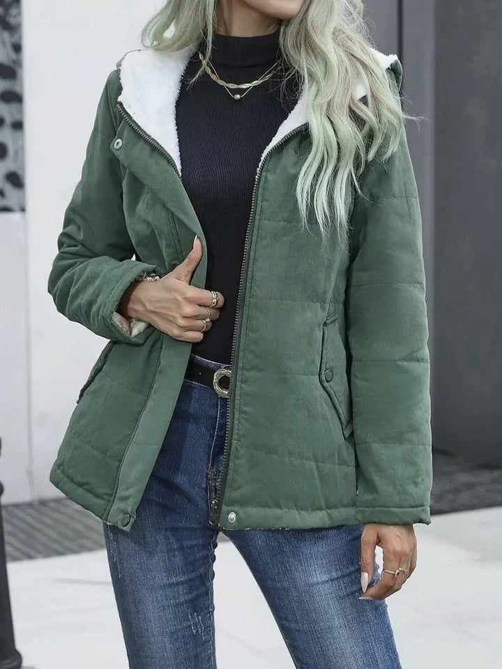 Women's fashionable zip-up hooded puffer, ideal for urban winter & cold weather.