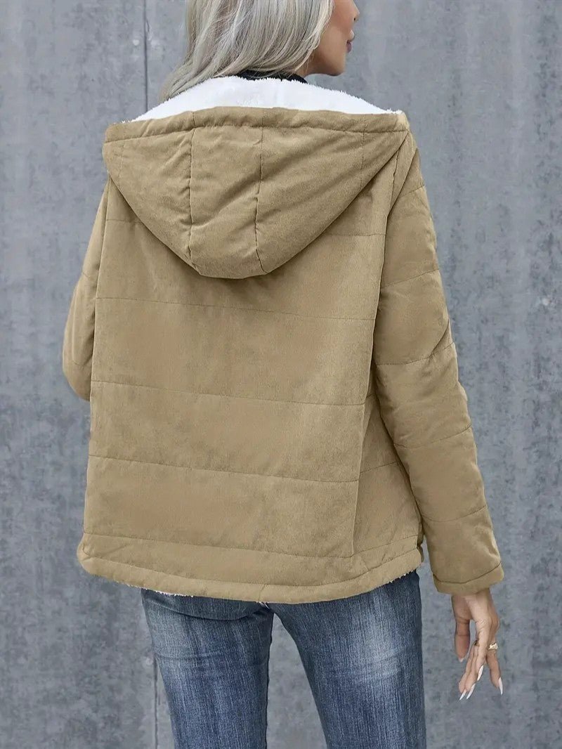 Seasonal women's hooded winter coat, zip-up, designed for optimal cold protection.
