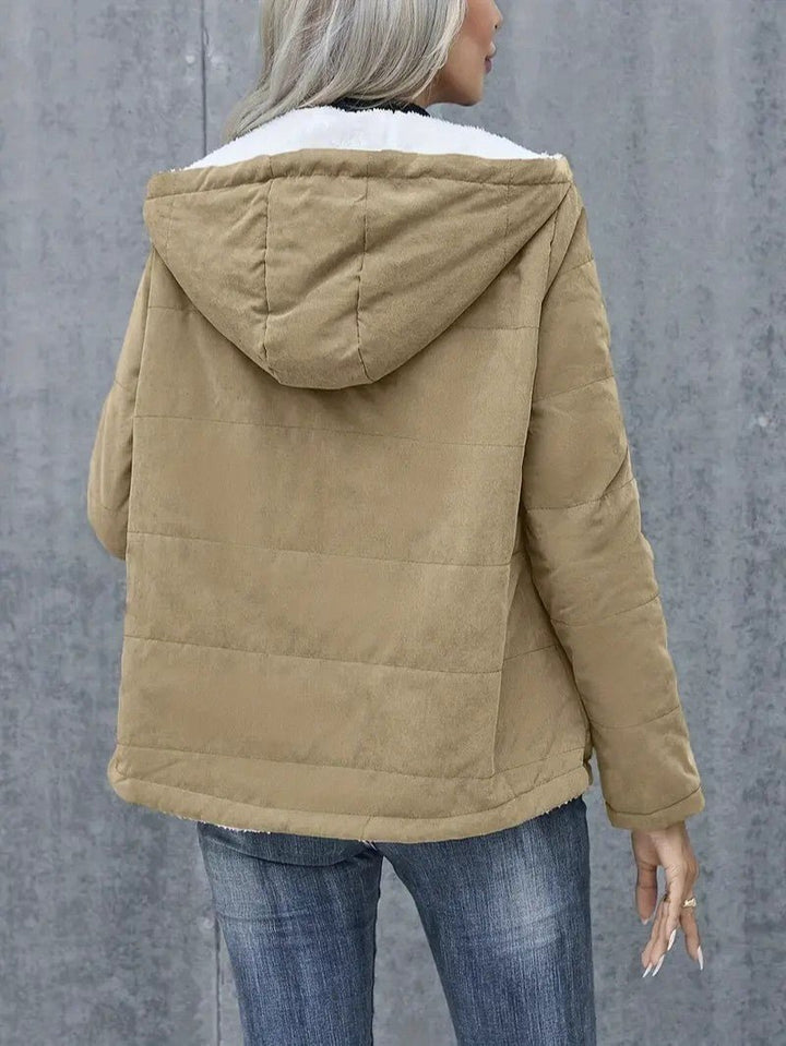 Seasonal women's hooded winter coat, zip-up, designed for optimal cold protection.