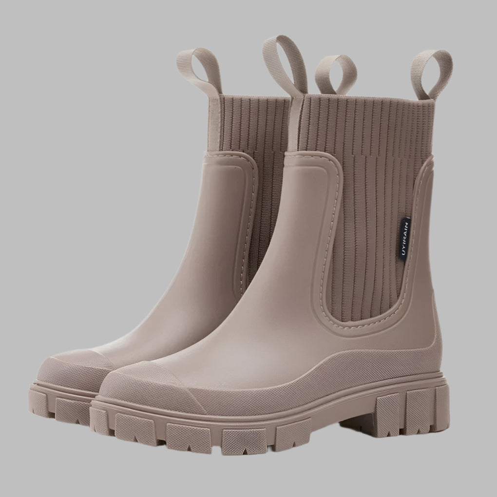 Women's waterproof Chelsea rain boots, black, slip-on style, durable for wet weather. Perfect for spring & fall.