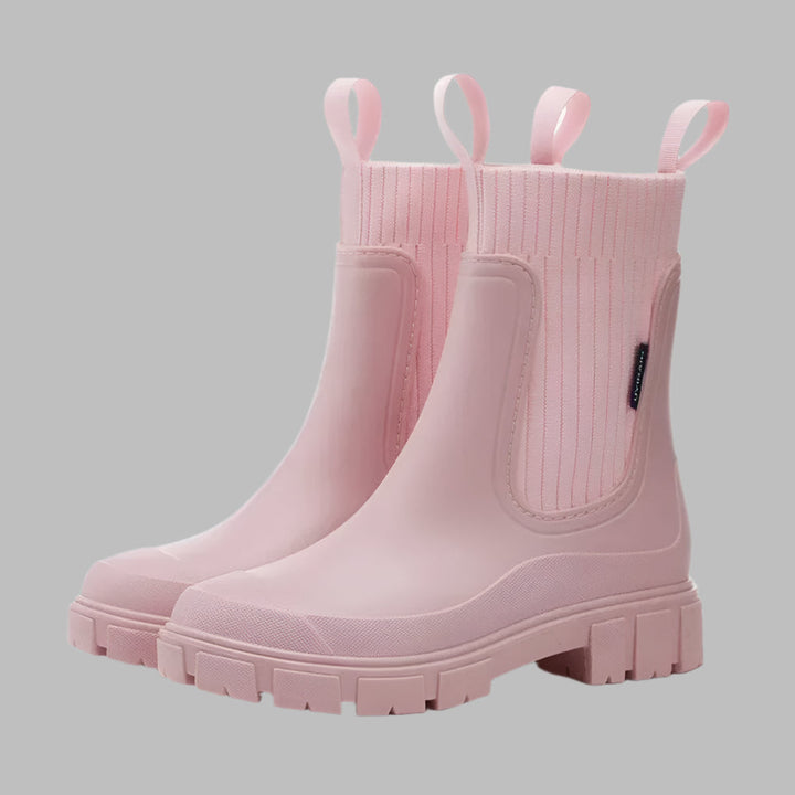 Stylish women's black Chelsea rain boots, waterproof, ideal for wet weather fashion & outdoor comfort. All-weather durable.