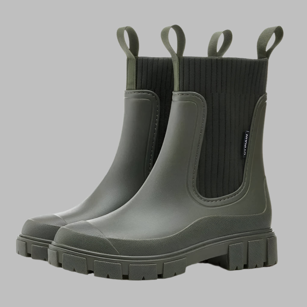 All-weather women's waterproof Chelsea rain boots, versatile black slip-on style for spring, fall, and wet conditions.